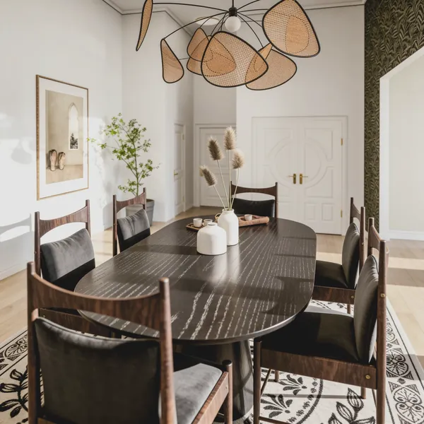 3D rendering of a dining room with an oval ebonized table, walnut chairs and a sculptural cane chandelier